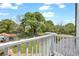 Backyard with lush trees and storage buildings from a balcony at 215 Fair St, Loganville, GA 30052