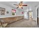 A bright room with carpet, neutral paint, and access to another room provides extra space at 215 Fair St, Loganville, GA 30052