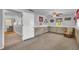 Finished basement offers extra living space with carpet, neutral paint, and access to other rooms at 215 Fair St, Loganville, GA 30052