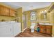 This bathroom is equipped with a shower, sink, toilet, washing machine, and dryer at 215 Fair St, Loganville, GA 30052