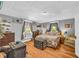 Cozy bedroom featuring hardwood floors, natural light, and charming decor at 215 Fair St, Loganville, GA 30052