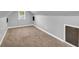 Spacious bedroom offers cozy carpet, natural light, and versatile design potential at 215 Fair St, Loganville, GA 30052
