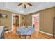Traditional dining room features hardwood floors, a tray ceiling, and classic furnishings at 215 Fair St, Loganville, GA 30052