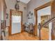 Charming entryway with hardwood floors, detailed woodwork, and a welcoming ambiance at 215 Fair St, Loganville, GA 30052