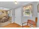 A bright entryway with hardwood floors, a window, and charming decor at 215 Fair St, Loganville, GA 30052