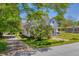 Charming two-story home featuring a welcoming front porch with a swing, stone pathway, and well-maintained lawn at 215 Fair St, Loganville, GA 30052