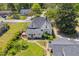 Aerial view of a well-maintained home featuring a balcony, a brick walkway and a hot tub in a green backyard at 215 Fair St, Loganville, GA 30052