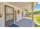 Inviting front porch with a swing, a welcome sign, and a view of the landscaped yard at 215 Fair St, Loganville, GA 30052