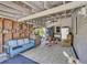 The garage features a couch, rocking horse, ceiling fan and assorted items at 215 Fair St, Loganville, GA 30052