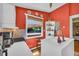 Bright kitchen features white counters, view of the neighborhood, and decorative shelves at 215 Fair St, Loganville, GA 30052