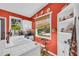 Well-lit kitchen with a window view features a white tile countertop, sink, and shelving at 215 Fair St, Loganville, GA 30052