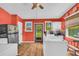 Bright kitchen with white countertops, modern appliances, and a view to the backyard at 215 Fair St, Loganville, GA 30052