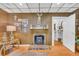 Living room featuring a stone fireplace, hardwood floors, and traditional decor at 215 Fair St, Loganville, GA 30052