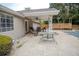 Rear patio with table, chairs and ceiling fan attached to home at 4184 Red Laurel Way, Snellville, GA 30039
