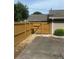 Fenced backyard with gate and gravel area next to the house at 4184 Red Laurel Way, Snellville, GA 30039