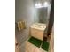 Bathroom featuring white vanity, neutral walls, and a decorative mirror, offering ample lighting at 4184 Red Laurel Way, Snellville, GA 30039