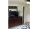 Bedroom features a dresser with a mirror and TV, with access to a closet at 4184 Red Laurel Way, Snellville, GA 30039