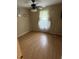 Bright bedroom with light colored walls, light floors, a ceiling fan, and a window at 4184 Red Laurel Way, Snellville, GA 30039