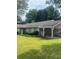 Single-story home with a covered carport, neat landscaping, and a well-maintained lawn and mature trees at 4184 Red Laurel Way, Snellville, GA 30039
