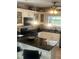 Modern kitchen with dark countertops, stainless steel appliances, and bright lighting that gives the area an elegant feel at 4184 Red Laurel Way, Snellville, GA 30039
