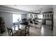 Kitchen with stainless steel appliances, a black cooktop, and dining area at 4184 Red Laurel Way, Snellville, GA 30039