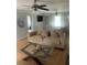 Spacious living room showcasing a comfortable sofa, a glass coffee table, stylish decor, and ample natural light at 4184 Red Laurel Way, Snellville, GA 30039