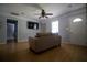 Comfortable living room featuring hardwood floors, neutral decor, and ample natural light, perfect for relaxation at 4184 Red Laurel Way, Snellville, GA 30039