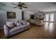 Cozy living room featuring hardwood floors, fireplace, and ample space for entertaining or relaxation at 4184 Red Laurel Way, Snellville, GA 30039