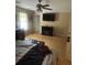 Main bedroom includes an electric fireplace, light floors, natural lighting and ceiling fan at 4184 Red Laurel Way, Snellville, GA 30039