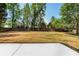 Large backyard features lawn and a privacy fence at 4307 Cedar Wood Sw Dr, Lilburn, GA 30047