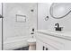 Stylish bathroom featuring a tub, marble-look shower, and modern black fixtures at 4307 Cedar Wood Sw Dr, Lilburn, GA 30047