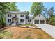 Charming white brick home featuring a two-car garage and a landscaped front yard at 4307 Cedar Wood Sw Dr, Lilburn, GA 30047