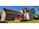 Exterior of home with brick and siding with raised garden area at 4662 Burns Rd, Lilburn, GA 30047