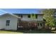 Backyard view of home with wood deck at 4662 Burns Rd, Lilburn, GA 30047