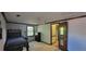 Bedroom with twin bed, dresser, and en-suite access, featuring natural light at 4662 Burns Rd, Lilburn, GA 30047
