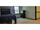 Bright bedroom featuring a twin bed with guitar decoration and a large window at 4662 Burns Rd, Lilburn, GA 30047