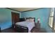 Comfortable bedroom with a bed, dresser, and window offering ample natural light at 4662 Burns Rd, Lilburn, GA 30047