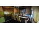 Traditional dining room featuring a large wooden table, upholstered chairs, and a china cabinet at 4662 Burns Rd, Lilburn, GA 30047