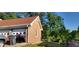 A detached garage with blue trim sits in a sunny backyard at 4662 Burns Rd, Lilburn, GA 30047