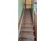 Stairway with patterned carpet and wooden handrails; a glimpse of home's interior at 4662 Burns Rd, Lilburn, GA 30047