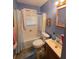 Cozy bathroom featuring a tub/shower combination and a vanity with storage at 502 S Evelyn Nw Pl, Atlanta, GA 30318