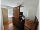 Modest bedroom featuring hardwood floors, ceiling fan and dresser at 502 S Evelyn Nw Pl, Atlanta, GA 30318