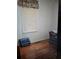 Bright bedroom with hardwood floors and a cozy seating area at 502 S Evelyn Nw Pl, Atlanta, GA 30318