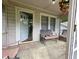 Inviting front porch offering a relaxing outdoor space with seating and a 'WELCOME' doormat at 502 S Evelyn Nw Pl, Atlanta, GA 30318