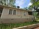 Side view of the home showing an exterior wall with visible utilities at 502 S Evelyn Nw Pl, Atlanta, GA 30318