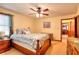 Bedroom with hardwood floors, ceiling fan, and natural light; a comfortable retreat for relaxation and rest at 2435 Farmer Road, Conyers, GA 30012