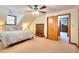 Cozy bedroom with a sloped ceiling, complemented by hardwood trim and a stylish dresser at 2435 Farmer Road, Conyers, GA 30012