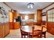 Spacious dining room features hardwood floors, wood trim, updated lighting, and is adjacent to the kitchen at 2435 Farmer Road, Conyers, GA 30012