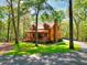 Charming exterior of a wooden home with a cozy front porch and lush lawn at 2435 Farmer Road, Conyers, GA 30012