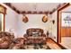 Charming living room with hardwood floors, woodland decor, and comfortable seating creates a cozy atmosphere at 2435 Farmer Road, Conyers, GA 30012